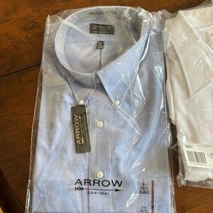 New in package blue long sleeved button down shirt